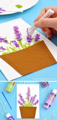 someone is painting lavender flowers in a pot with glue and watercolor pencils on the table