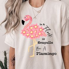 This adorable flamingo Tee comes in a variety of sizes from S-5XL. . No side seams mean there are no itchy interruptions under the arms. The shoulders have tape for improved durability. .: 100% cotton (fiber content may vary for different colors) .: Medium fabric .: Classic fit .: Tear-away label .: Runs true to size Pink Flamingo Print T-shirt For Summer, Casual Summer T-shirt With Flamingo Print, Casual Flamingo Print T-shirt For Summer, Casual T-shirt With Flamingo Print For Summer, Casual Crew Neck T-shirt With Flamingo Print, Pink Flamingo Print Short Sleeve T-shirt, Pink Short Sleeve T-shirt With Flamingo Print, Casual Pink Flamingo Print T-shirt, Casual Pink T-shirt With Flamingo Print