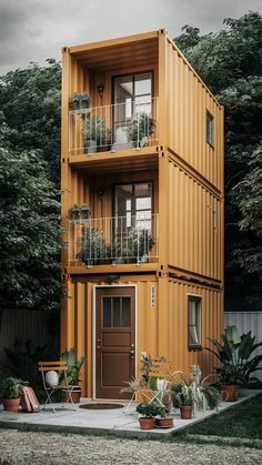 a tall building made out of shipping containers with plants growing on the balconies