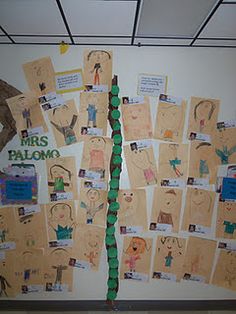 a bulletin board is covered with pictures and words for the children's art project