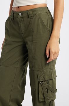 Achieve casual-cool perfection in these cool cotton pants fitted with D-ring-secured cargo pockets. 32" inseam; 22 1/2" leg opening; 10" front rise; 14" back rise (size 29) Zip fly with button closure Front slant pockets; cargo flap-patch pockets; back button-flap patch pockets 100% cotton Machine wash, line dry Imported Cargo Pants In Store, Pink Cargo Pants, Pacsun Pants, Cotton Cargo Pants, Baggy Pants, Baggy Pant, Maternity Shops, Black Women Fashion, Loungewear Shorts