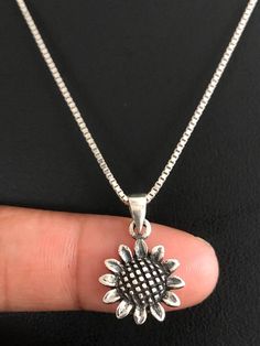 Dainty & delicate Sunflower NecklaceNECKLACE FEATURES:Metal:  All components are made from solid .925 Sterling Silver Model is wearing 16" in length solid .925 Sterling Silver Chain Length available:  16", 18" or 20"MEASUREMENTSunflower Pendant:  Height: 21 mm (0.83 inch)Your Dainty Sunflower Necklace will arrive in a gift box, beautifully wrapped and ready for giftingPlease send me a message if you have any questions before or after placing your order.  Please also view my policy before pur Sunflower Charm, October Birthstone Jewelry, Beaded Ankle Bracelets, Silver Model, Beaded Ankle, Sunflower Jewelry, Fire Opal Necklace, Sunflower Pendant, Sunflower Necklace