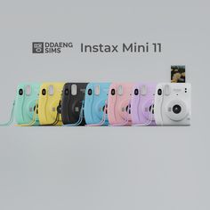 a group of cameras sitting next to each other on top of a shelf with the words instax mini 11 in front of them