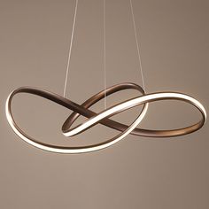 a modern light fixture hanging from the ceiling