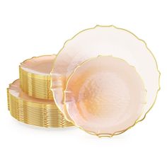 two plates with gold rims stacked on top of each other