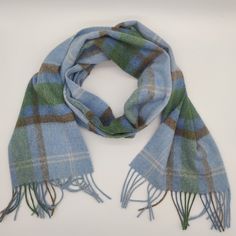 Irish Lambswool scarf - 100% Pure New Wool - blue/green/light brown/white - tartan/plaid check - very soft - unisex - HANDMADE IN IRELAND Keep warm in style this season with our supersoft lambswool scarf. Woven in Ireland in traditional country checks with fringed trim. Lambswool is the highest quality sheep's wool. Along with being a naturally insulating, breathable and hypoallergenic textile, it's beautifully soft. Not to be confused with sheep's wool, lambswool is the wool from the first shea Scottish Plaid Winter Scarf, Casual Wool Plaid Scarves, Casual Plaid Wool Scarf, Baby Sheep, Wool Clothing, Teal And Grey, Wool Shawl, Tartan Plaid, Keep Warm