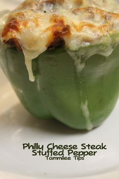 a green pepper covered in cheese and sauce