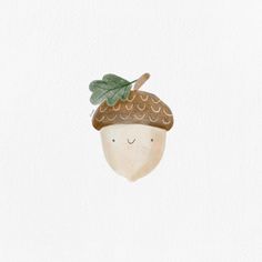 an acorn with leaves on it's head is shown in the shape of a mushroom