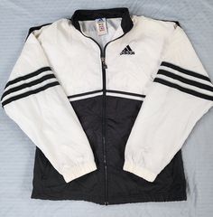 Vintage 1990s Adidas Black White Track Jacket  In great condition  Small stains white areas (see pictures) Small 25.5 x 23 Pit to Pit  Any questions feel free to reach out! Adidas Old School Track Suit, Vintage White Outerwear For Streetwear, Vintage White Long Sleeve Track Jacket, White 90s Track Jacket With Long Sleeves, White Vintage Track Jacket For Spring, 90s Style White Long Sleeve Track Jacket, 90s White Sports Outerwear, Vintage White Track Jacket For Streetwear, Vintage White Windbreaker For Fall