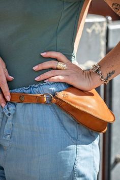 Want to update your leather accessories or add a new handbag to your winter wardrobe? This brown leather pouch is perfect for upgrading your small sporty sling bag. Made with classic light brown, saddle-colored, soft leather and stunning blue and white floral lining. This pouch will go perfectly with your favorite winter outfit or vacation style.

#travelpouch #travelessentials #leatherbag #leatherpouch #slingbag Handbag Essentials, Leather Fanny Pack, Leather Bags Handmade, Travel Pouch, Leather Pouch, Pouch Bag, New Handbags, Winter Wardrobe, Leather Accessories