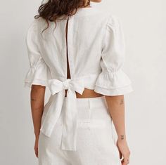 "This top features a square neckline, short sleeves with flowy details, 2 button closures at the back of the neck, an open back with self-tie bands and cropped length, perfect linen top for the summer, beach or everyday use. The model is wearing size S. DETAILS: - 100% linen - handmade to order - open back - tie on the back - cropped length - Ruffle Sleeve Sizing XS Best for busts up to 32'' Best for waists: 26\" Best for hips: 35\" S Best for busts: 34\" Best for waists: 28\" Best for hips: 37\ Back Tie Top, Honeymoon Wear, Linen Crop Top, Backless Crop Top, Backless Top, Cropped Tops, Cropped Tube Top, Rust Orange, Crop Blouse