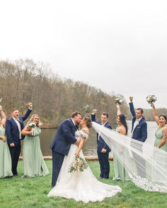 a bride and groom are surrounded by their bridal party