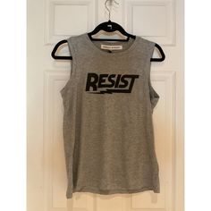 Rebecca Minkoff Resist Muscle Tee Xs Heather Gray & Black Style#R19401a17 Nwt. Pit To Pit - 18” Shoulder To Waist - 23” Casual Sleeveless T-shirt With Logo Print, Sleeveless Slogan Tops For Streetwear, Slogan Sleeveless Top For Streetwear, Gray Spring Streetwear Tops, Black Sleeveless Slogan Top, Sleeveless Black Slogan Top, Gray Sleeveless Top For Streetwear, Fitted Casual Muscle Tee, Urban Gray Tops For Spring