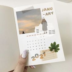 a person holding up a calendar with pictures on it and the words janu - ary