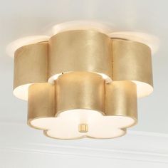 a light that is hanging from the ceiling in a room with white walls and ceilings