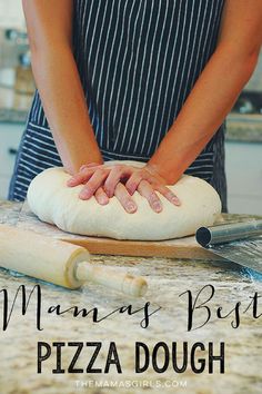 the woman is making pizza dough on the counter