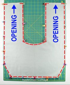 an open cutting mat with red and blue lines on it