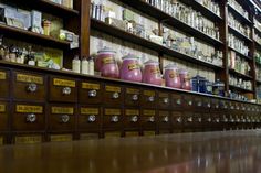 the shelves are filled with many different types of jars