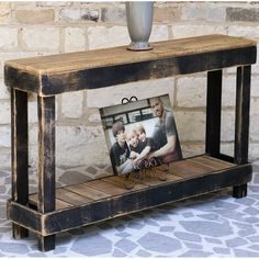 a wooden table with a photo frame on it