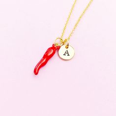 This is a gold or silver-tone SMALL red hot chili charm with hand stamped initial charm on stainless steel necklace. ♥ You will receive one necklace. HOW TO ORDER 1) Choose the quantity. 2) Choose the initial and finish in the option or add a note to seller at checkout. 3) Add to the cart. DESCRIPTION ♥ Necklace, Stainless Steel Chain with Lobster Claw Clasp, Size: about 17.7 inches (45cm) long, 1-2mm wide, Nickel Safe,  ♥ Initial Charms, Stainless Steel, Size: about 8-10mm in diameter, 1mm thic Personalized Red Jewelry Gift, Personalized Red Jewelry For Gift, Personalized Red Jewelry For A Gift, Personalized Red Dangle Jewelry, Adjustable Red Personalized Necklace, Personalized Red Necklace For Gift, Novelty Red Charms Jewelry, Red Novelty Jewelry With Charms, Novelty Red Jewelry With Charms