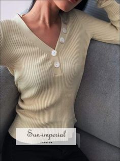 Sun-imperial Beige V Neck Ribbed Jumper with Button detail Deep V Neck Rib Knit top High Street Fashion V-neck Top With Buttons For Fall, Trendy V-neck Top With Buttons, Beige Ribbed V-neck Top, V-neck Top With Button Closure For Fall, V-neck Button Top For Fall, V-neck Buttoned Tops For Fall, Winter Knit Tops With Buttons, Beige Buttoned Tops For Winter, Trendy Winter Tops With Buttons