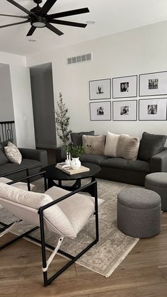 a living room filled with furniture and a ceiling fan