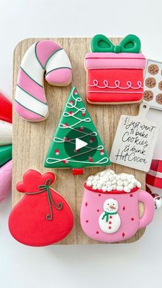 decorated christmas cookies on a wooden tray