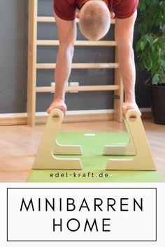 a man standing on top of a green mat in front of a wooden ladder with the words, edelkrart de minibarren home