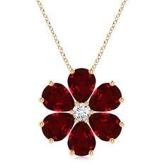 Crafted in 14k yellow gold, this ruby and diamond pendant features an alluring floral design. Pear-shaped rubies dazzle with their striking red allure and are embellished around a sparkling diamond, forming a dainty flower. Ruby Pendant, Cluster Pendant, Flower Pendant, Sparkle Diamonds, 18k Rose Gold, Pear Shaped, Diamond Pendant, Prong Setting, Ruby