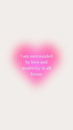 a pink heart with the words i am surrounded by love and positivity in all forms