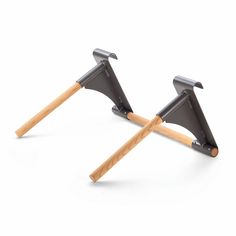 two wooden and metal hammers on top of each other in the shape of an upside down triangle