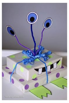 a cake decorated to look like a box with eyes on it