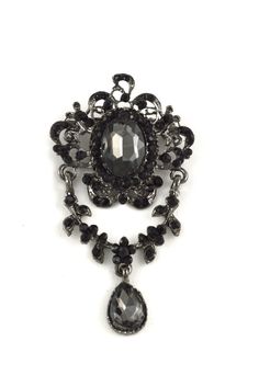 "This vintage styled brooch features delicate and intricate metal workings as well as dark acrylic stones for a gothic feel. This item has a standard brooch pin for easy and convenient application. This brooch is a perfect addition to any garment or accessory. Additionally, you can add this brooch to a gift box for a unique and memorable effect. Dimensions: Approx. 3.14\" x 1.75\" Visit our shop for more ideas! https://www.etsy.com/shop/OneStopTrims?ref=hdr_shop_menu" Gothic Brooch, Gothic Prom Dress, Dark Jewelry, Gothic Vampire, Dark Look, Rhinestone Brooches, Lace Collar, Gothic Jewelry, Buttons Pinback