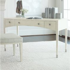 a white desk and chair in a room