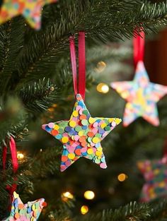 christmas ornaments are hanging from the tree