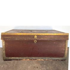 an old trunk is sitting on the floor