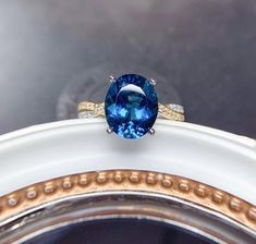 Welcome to Elegant Art Jewelry!  Stone: Natural London Blue Topaz Stone Size: 9mmx11mm Side Stone: Zirconia Metal: 925 Sterling Silver Personalization: 9K/14K/24K/GOLD/SILVER/PLATINUM/ROSE-GOLD/WHITE GOLD. (Contact me)  Topaz Ring, Topaz Cuff Ring, 925 Sterling Silver Ring, Oval Shape Ring, Topaz Ring, Topaz Engagement, Open Design Ring, Topaz Oval, Topaz Natural, Blue Topaz, Blue Gemstone, Gemstone Ring, Engagement Ring, Wedding Ring, Statement Ring, Topaz Ring, Victorian Ring, Topaz Engagement Blue Topaz Ring Sterling Silver, Topaz Wedding Ring, Pink Topaz Ring, Topas Ring, Oval Cut Ring, Green Emerald Ring, Luxury Ring, Victorian Ring, Gold Topaz