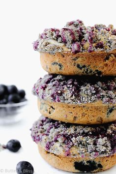 three blueberry muffins stacked on top of each other