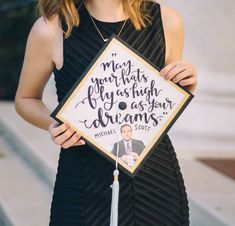 a woman holding up a graduation cap with the words, my god has always brought you as your dreams