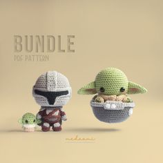 two crocheted yoda and baby yoda dolls, one holding an infant yoda