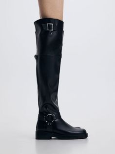 A thigh-high version of the classic biker boot, this pair will definitely make a statement this season. The utilitarian style is minimal but sleek, with edgy silver-toned harness details that stand out against the versatile black finish. For a more comfortable fit, their wider top edges are adjustable with the help of belted side buckles. When it comes to accessorising this winter, these boots are a failproof choice that is stylish and functional at once. Utilitarian Style, Charles Keith, Thigh High Boots, Thigh High, Thigh Highs, Biker Boot, High Boots, Black Boots, The Help