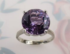 Classic Amethyst Jewelry With Center Stone, Timeless Round Purple Jewelry, Timeless Amethyst Jewelry For Wedding, Elegant Lavender Jewelry With Center Stone, Timeless Purple Round Jewelry, Classic Amethyst Jewelry With Prong Setting, Timeless Round Amethyst Ring, Classic Jewelry With Prong Setting Amethyst, Elegant Purple Amethyst Ring With Round Band