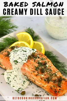 baked salmon with creamy dill sauce on a white plate