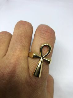 Cool Vintage Rock and Roll star men's ring Nice heavy ring, golden Stainless Steel Unused stock from the 1980's I have an assortment of sizes from 6, 7 to 8, 9 ,10, 11, 12- 13 Please add your size to the order in a message and I will send the size you require. If I am out of stock in your size, I will list the ones I have available for replacement. If I am sold out in the sizes you would prefer, I will cancel and refund you, Thank you All jewelry is shipped in a nice gift box. Check out our over Egyptian Ankh, Mens Stainless Steel Rings, Earthy Jewelry, Historical Jewellery, Egyptian Jewelry, Golden Ring, Vintage Gothic, Vintage Rock, Mens Ring