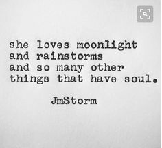 an old typewriter with the words, she loves moonlight and rains and so many other things that have soul