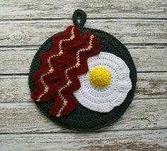 a crocheted ornament with an egg and bacon on it