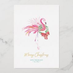 a christmas card with a pink flamingo on it