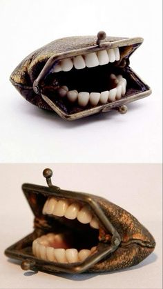 an open wallet with teeth on the inside and in the outside, both opened up