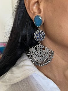 Premium Quality, Silver Replica at its best. Complement your personality with this gorgeous Earrings. Handcrafted in brass, oxidized, stones The weight of the Earrings is 38 grams per pair. The length of the earrings is 10 cm. The width of the earrings is 5 cm. Oxidized Brass Jhumkas, Heavy Brass Drop Earrings, Metal Chandbali Danglers For Pierced Ears, Bohemian Oxidized Chandelier Earrings For Wedding, Bohemian Oxidized Chandelier Earrings For Festive Occasions, Bohemian Oxidized Finish Chandelier Earrings For Festive Occasions, Bohemian Chandelier Earrings With Oxidized Finish For Wedding, Festive Brass Earrings With Oxidized Finish, Temple Jewelry Brass Danglers With Oxidized Finish