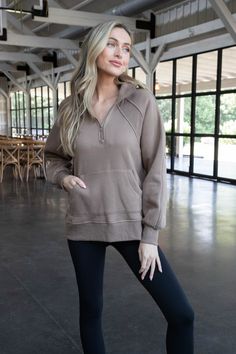 Stay cozy and stylish in our Faye Quarter Zip Sweatshirt in Mocha. The rib details and front pocket add a touch of uniqueness to this wardrobe staple. Don't miss out on the convenience of a quarter zip and the added warmth of a mock neck. (Warning: may cause extreme comfort and all-day lounging!) General Info: Self: 70% Cotton, 30% Polyester Contrast: 95% Cotton, 5% Spandex Hand Wash Cold; Dry Flat Quarter Zip Rib Details Front Pocket Mock Neck Fit Guide: Shape & Fit: Relaxed Fabric Elasticity: Minimal Stretch Fabric Texture: Soft, Ribbed Details Model Info: Height: 5’8” | Bust: 30.5” | Waist: 23.5” | Hip: 33” | Size Shown: Small Fall Half-zip Sweatshirt With Kangaroo Pocket, Half-zip Sweatshirt With Kangaroo Pocket For Fall, Cozy Half-zip Top With Pockets, Cozy Top With Kangaroo Pocket, Brown Sweatshirt With Kangaroo Pocket For Loungewear, Half-zip Loungewear Tops With Pockets, Comfy Everyday Top With Kangaroo Pocket, Comfy Tops With Kangaroo Pocket For Everyday, Loungewear Half-zip Tops With Pockets